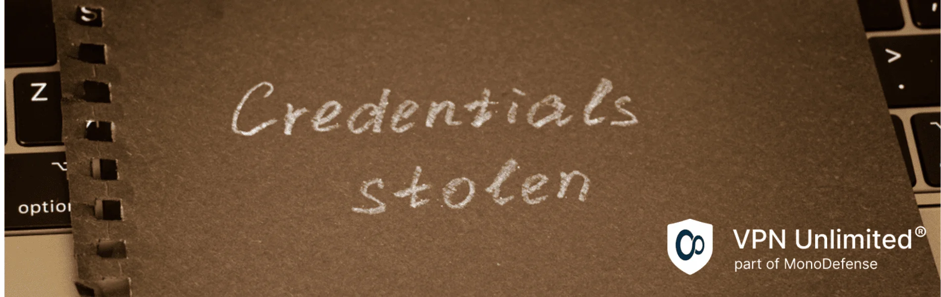Credentials stolen phrase written in white pencil on a piece of black paper, lies on a laptop keyboard. Concept of information security