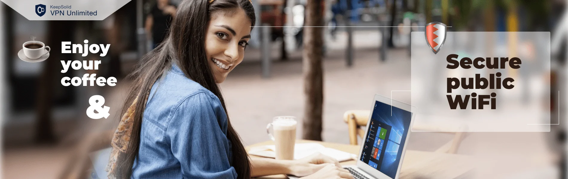 Portrait of beautiful woman using Windows laptop and Windows VPN for security on public WiFi while sitting at sidewalk cafe