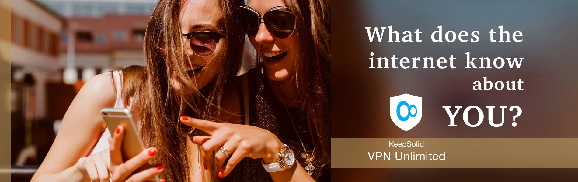 young pretty women posing in the street with phone protected with KeepSolid VPN Unlimited